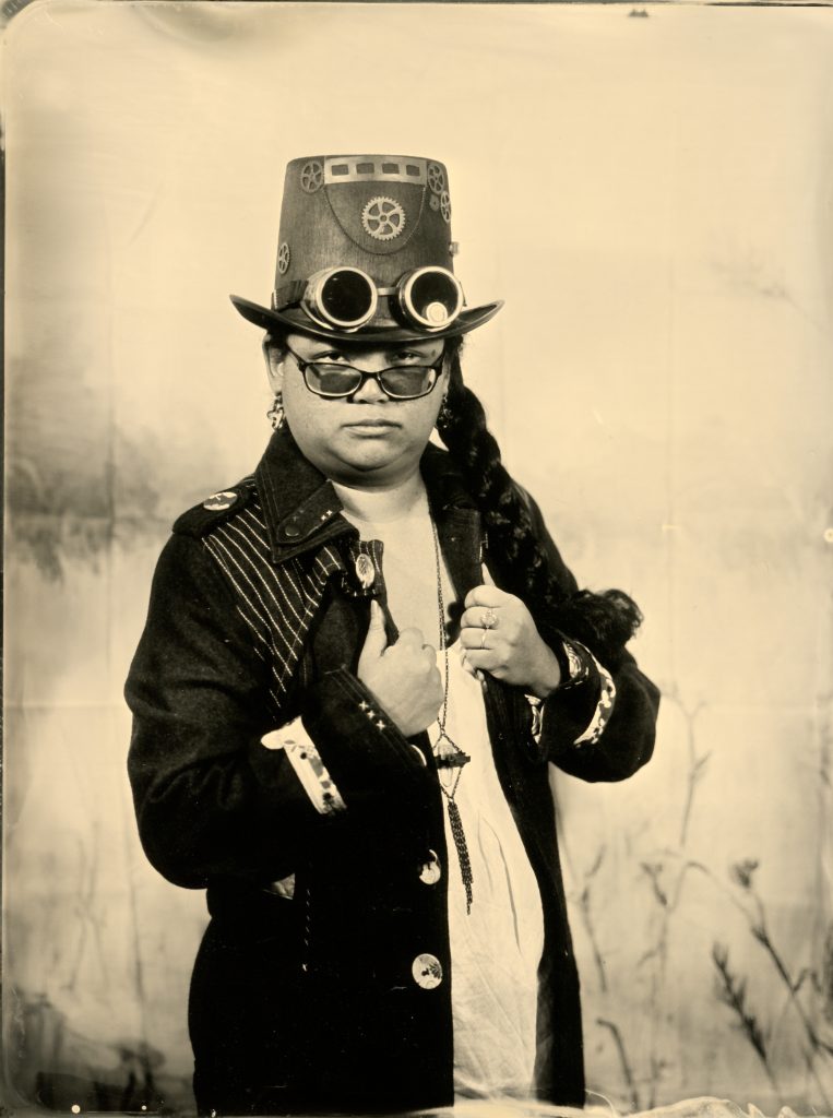 Wetplate portrait of a sitter in a decorated top hat and jacket