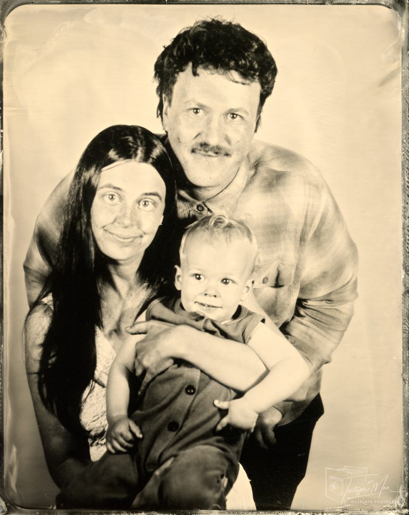 Wetplate family portrait of parents holding their baby