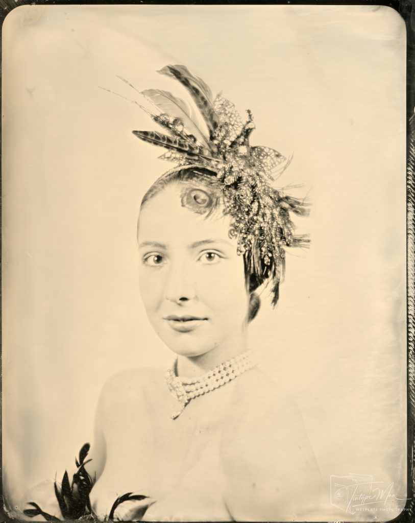 Wetplate portrait of a woman wearing a floral headpiece.