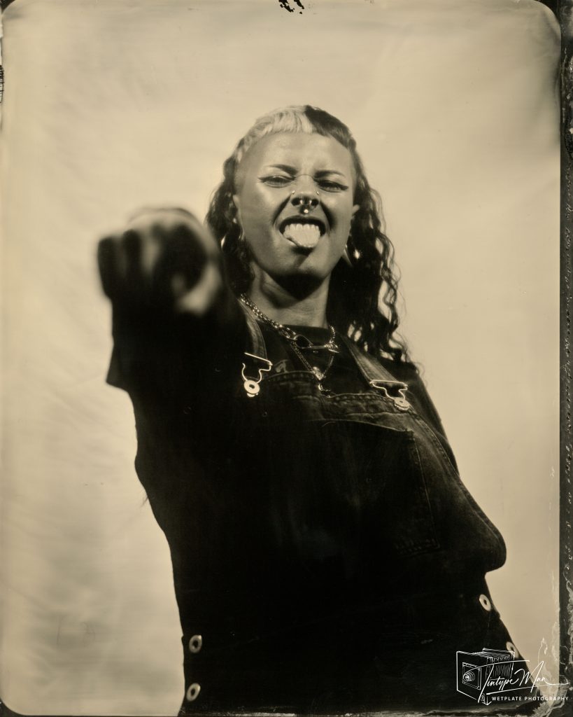 Expressive wetplate portrait of a woman reaching towards the camera